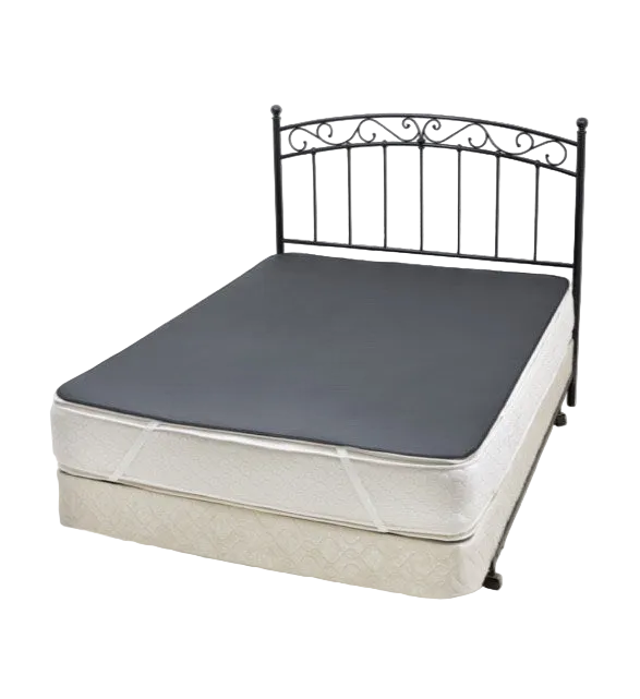 Queen bed with metal headboard with grey Earthing grounding mat underlay covering the top of the mattress.