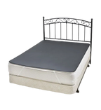 Queen bed with metal headboard with grey Earthing grounding mat underlay covering the top of the mattress.